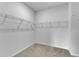 A walk-in closet with wire shelving for optimal organization and storage at 242 Luftee Ln, Holly Springs, NC 27540