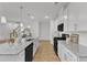 The kitchen is equipped with modern appliances, granite countertops and a convenient island at 242 Luftee Ln, Holly Springs, NC 27540