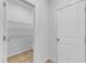 Pantry area features organized shelving, and is perfect for storage of food items at 242 Luftee Ln, Holly Springs, NC 27540
