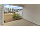 Covered outdoor patio offering views of the expansive lawn and neighborhood beyond at 242 Luftee Ln, Holly Springs, NC 27540
