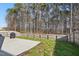 Backyard offers a concrete patio, a wood fence and plenty of trees to offer privacy at 250 Hawksbill Dr, Franklinton, NC 27525