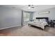 A well-lit bedroom with carpeted floors, a comfortable bed, and a window, creating a relaxing atmosphere at 250 Hawksbill Dr, Franklinton, NC 27525