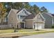 Attractive two-story home with a well-kept lawn and attached two-car garage, showcasing curb appeal at 250 Hawksbill Dr, Franklinton, NC 27525