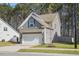 A view of the side of the house with a driveway and a two car garage at 250 Hawksbill Dr, Franklinton, NC 27525