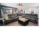 A cozy living room showcases two leather sofas, a rustic coffee table, and an open floor plan with hardwood floors at 250 Hawksbill Dr, Franklinton, NC 27525