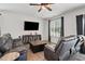Cozy living room with comfortable leather seating, modern entertainment setup, and natural light at 250 Hawksbill Dr, Franklinton, NC 27525