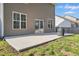 Home's back exterior features a concrete patio and a grassy lawn, great for outdoor enjoyment at 250 Hawksbill Dr, Franklinton, NC 27525