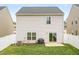 This backyard has a patio, grill, and fresh green grass at 2512 Lily Dr, Haw River, NC 27258