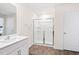 This bathroom includes a large mirror and a shower at 2512 Lily Dr, Haw River, NC 27258