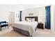 This bedroom features a large window and a soft carpet at 2512 Lily Dr, Haw River, NC 27258