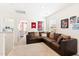 Comfortable bonus room with a large sectional sofa, perfect for relaxation and entertainment at 2512 Lily Dr, Haw River, NC 27258