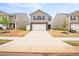 Charming two-story home with a two car garage, brick accents, manicured lawn, and a beautiful flower bed at 2512 Lily Dr, Haw River, NC 27258