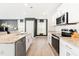 A modern kitchen provides the perfect cooking experience with stainless steel appliances, granite counters, and an island at 2512 Lily Dr, Haw River, NC 27258
