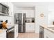 Close up view of a modern kitchen with stainless steel appliances and ample cabinet space for storage at 2512 Lily Dr, Haw River, NC 27258