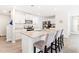 Modern kitchen with white cabinets, stainless steel appliances, and a granite island with breakfast bar at 2512 Lily Dr, Haw River, NC 27258