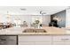 Open kitchen overlooking the living area with dining space, promoting seamless interaction and a spacious feel at 2512 Lily Dr, Haw River, NC 27258