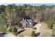 Sprawling property showcasing a stately brick home surrounded by lush greenery at 2514 Mcgowan Ct, Wake Forest, NC 27587