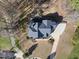 Aerial view of an expansive home on a large lot surrounded by trees and landscaping at 2514 Mcgowan Ct, Wake Forest, NC 27587