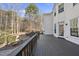 A spacious wooden deck is attached to the home, offering outdoor living space overlooking the wooded backyard at 2514 Mcgowan Ct, Wake Forest, NC 27587