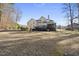 A sprawling home with a backyard featuring a wooden deck, screened in porch, and a large yard at 2514 Mcgowan Ct, Wake Forest, NC 27587