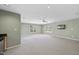 Unfurnished basement area has plenty of natural light, a wet bar and neutral carpeting at 2514 Mcgowan Ct, Wake Forest, NC 27587