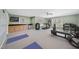 Renovated basement includes fitness equipment, cabinets with sink, and space for yoga and workouts at 2514 Mcgowan Ct, Wake Forest, NC 27587