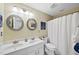 Bathroom featuring double vanity sinks, a toilet, mirror and shower featuring a curtain at 2514 Mcgowan Ct, Wake Forest, NC 27587