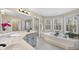 Spacious bathroom featuring a soaking tub, enclosed shower, double vanity and many bright view windows at 2514 Mcgowan Ct, Wake Forest, NC 27587