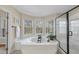 Luxurious bathroom with a soaking tub, enclosed shower, and bright view windows for relaxing at 2514 Mcgowan Ct, Wake Forest, NC 27587