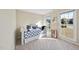 Bright bedroom with two large sunny windows, a daybed and tasteful accent decor at 2514 Mcgowan Ct, Wake Forest, NC 27587