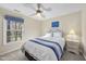 Cozy bedroom featuring a ceiling fan, a bright window and a comfortable bed with tasteful decor at 2514 Mcgowan Ct, Wake Forest, NC 27587