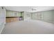 Spacious bonus room with a wet bar, neutral carpet, and great natural light at 2514 Mcgowan Ct, Wake Forest, NC 27587