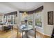 Cozy dining area with natural light, door to deck and decorative accents at 2514 Mcgowan Ct, Wake Forest, NC 27587
