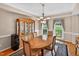 Traditional dining room features wood table, elegant chandelier, and display cabinet with natural light at 2514 Mcgowan Ct, Wake Forest, NC 27587