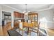 Elegant dining room with wood table, china cabinet, and chandelier lighting at 2514 Mcgowan Ct, Wake Forest, NC 27587