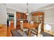 Elegant dining room featuring hardwood floors, a chandelier, a built-in hutch, and space for entertaining at 2514 Mcgowan Ct, Wake Forest, NC 27587