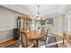 Charming dining area with a wood table, display cabinet and hardwood flooring at 2514 Mcgowan Ct, Wake Forest, NC 27587