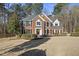 Traditional brick home featuring a manicured lawn and detailed trim at 2514 Mcgowan Ct, Wake Forest, NC 27587