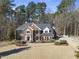 Beautiful two-story brick home with a manicured lawn and mature trees at 2514 Mcgowan Ct, Wake Forest, NC 27587