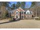 Classic brick home with well-maintained landscaping and a welcoming entrance at 2514 Mcgowan Ct, Wake Forest, NC 27587