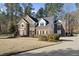 Handsome brick home with black shutters and a curved driveway at 2514 Mcgowan Ct, Wake Forest, NC 27587