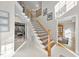 Inviting foyer with wood and iron staircase, neutral walls and an open floor plan at 2514 Mcgowan Ct, Wake Forest, NC 27587