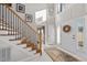 Spacious foyer with staircase, tile flooring, and natural light at 2514 Mcgowan Ct, Wake Forest, NC 27587