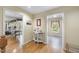Hallway with hardwood floors leading to sunroom, entry foyer and laundry room at 2514 Mcgowan Ct, Wake Forest, NC 27587