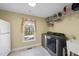 Laundry room with window, utility sink, and washer and dryer at 2514 Mcgowan Ct, Wake Forest, NC 27587