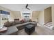 Comfortable living area with a large sectional sofa, ceiling fan, and plenty of natural light at 2514 Mcgowan Ct, Wake Forest, NC 27587