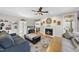 Bright living room with hardwood floors, fireplace, and ample seating at 2514 Mcgowan Ct, Wake Forest, NC 27587