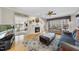 Cozy living room with a fireplace, hardwood floors and lots of natural light at 2514 Mcgowan Ct, Wake Forest, NC 27587