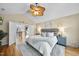 Large main bedroom boasts hardwood floors, an open doorway, and vaulted ceilings at 2514 Mcgowan Ct, Wake Forest, NC 27587