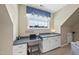 A cozy office space with custom cabinets, desk, natural light, and a comfortable chair at 2514 Mcgowan Ct, Wake Forest, NC 27587